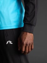 Majica dugih rukava Wata – Fluo tirkizna / Crna, detalj
